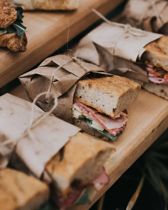 Sandwiches wrapped in paper and tied with string